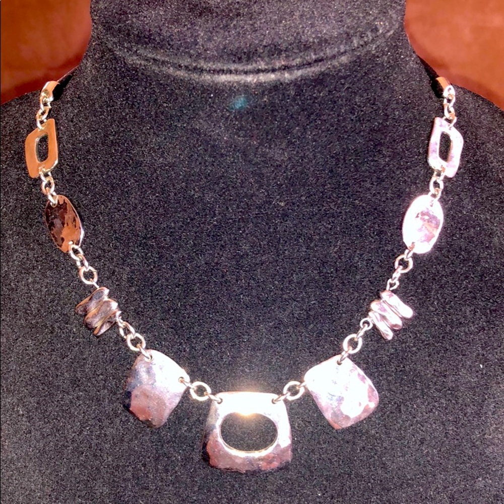 Pebbled silver and leather necklace.